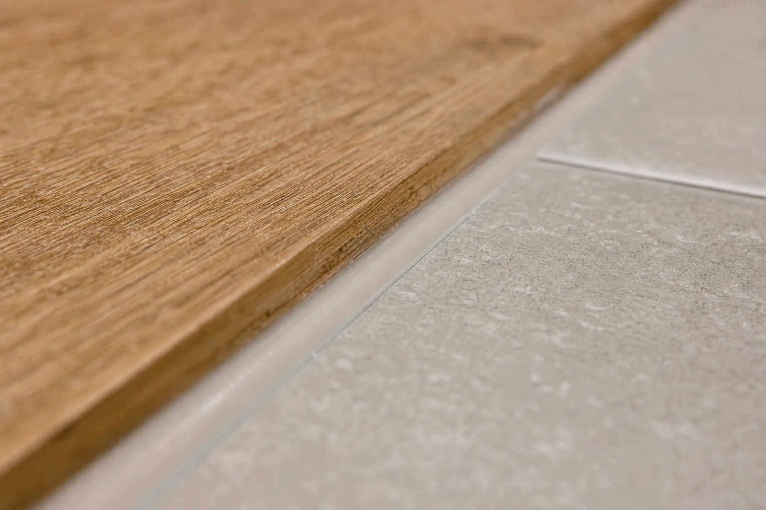 Transition trim between tiled ensuite and timber hallway